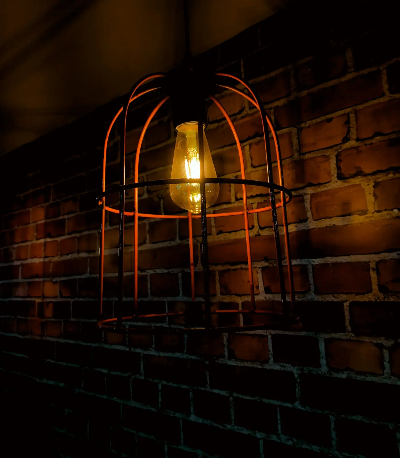 Warm lamplight against brick, in the style of the dining room